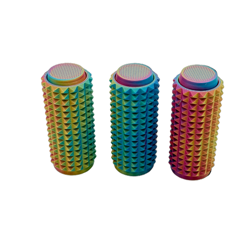 Three colorful cylindrical objects with textured surfaces on a white background